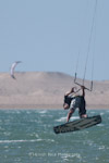 A kite surfer performing a handle pass. Dakhla, Weatern Sahara.