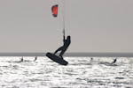 A kite surfer seems to hang in the air during a long jump. Dakhla, Weatern Sahara.
